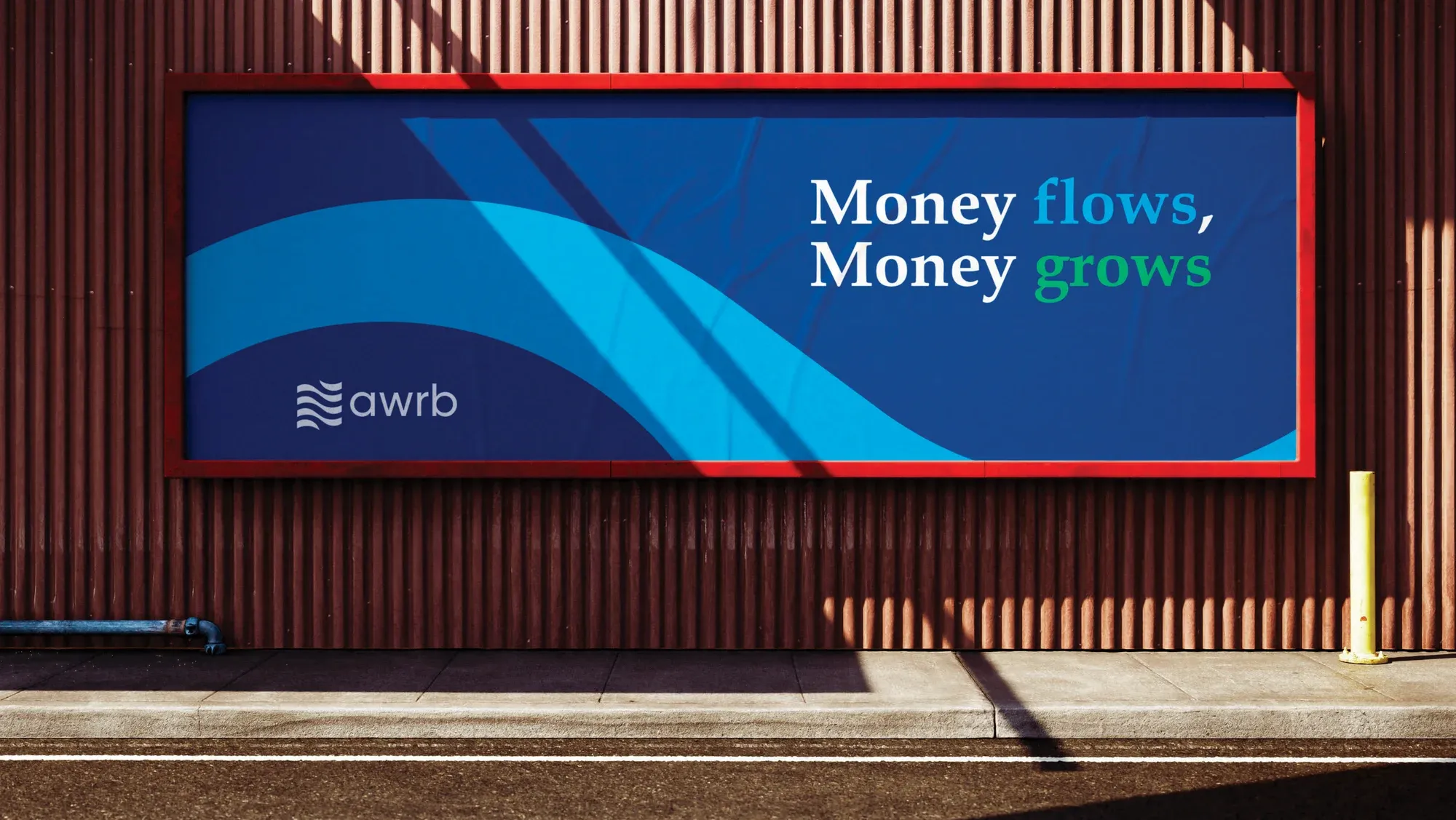 A billboard on a corrugated wall reading money flows, money grows, over a blue wave graphic.
