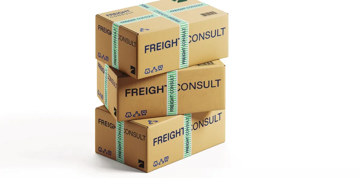 Stacked cartons sealed with branded Freight Consult tape.