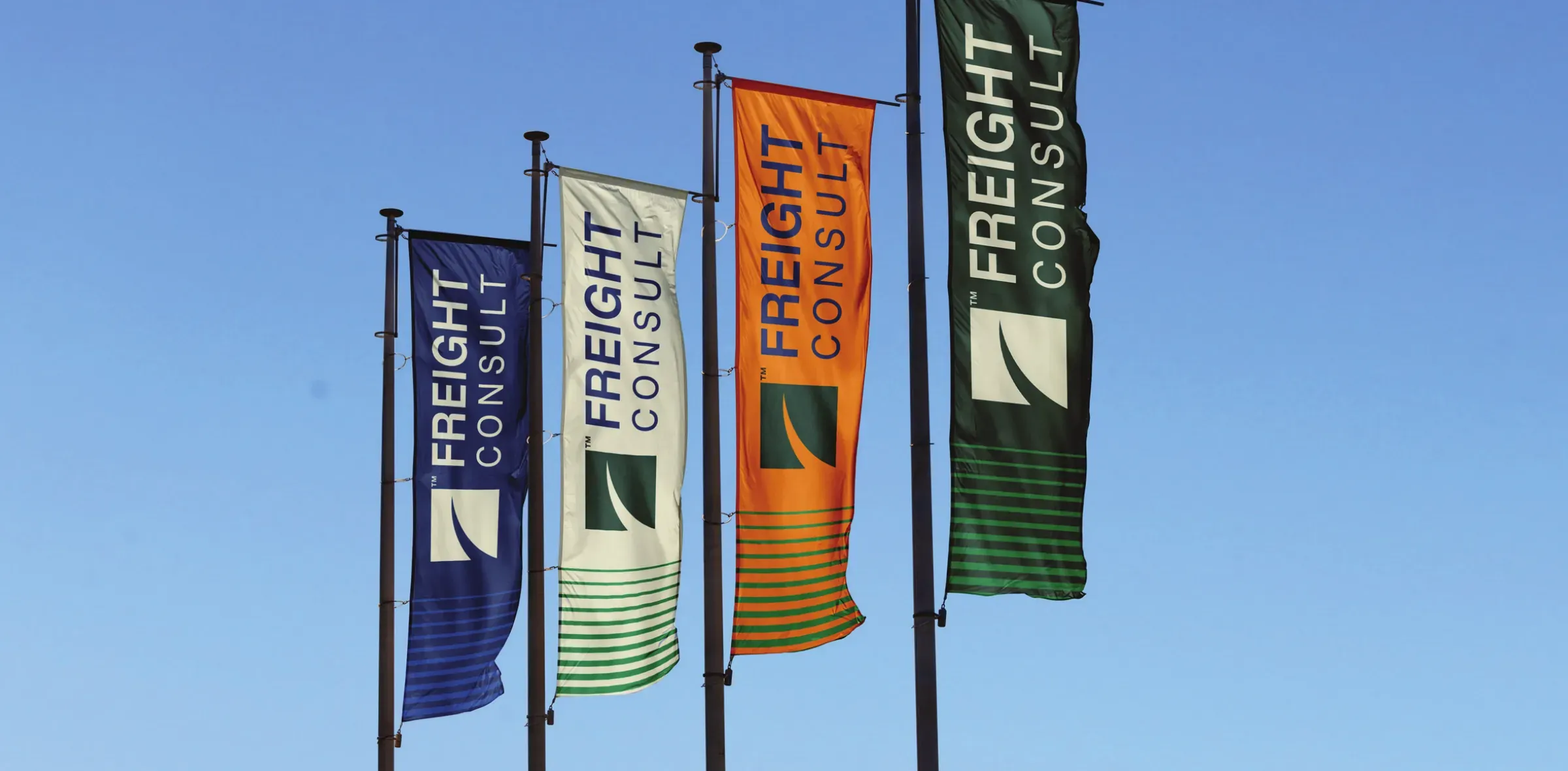 Four Freight Consult flags in blue, beige, orange and green, showing the palette's full range.