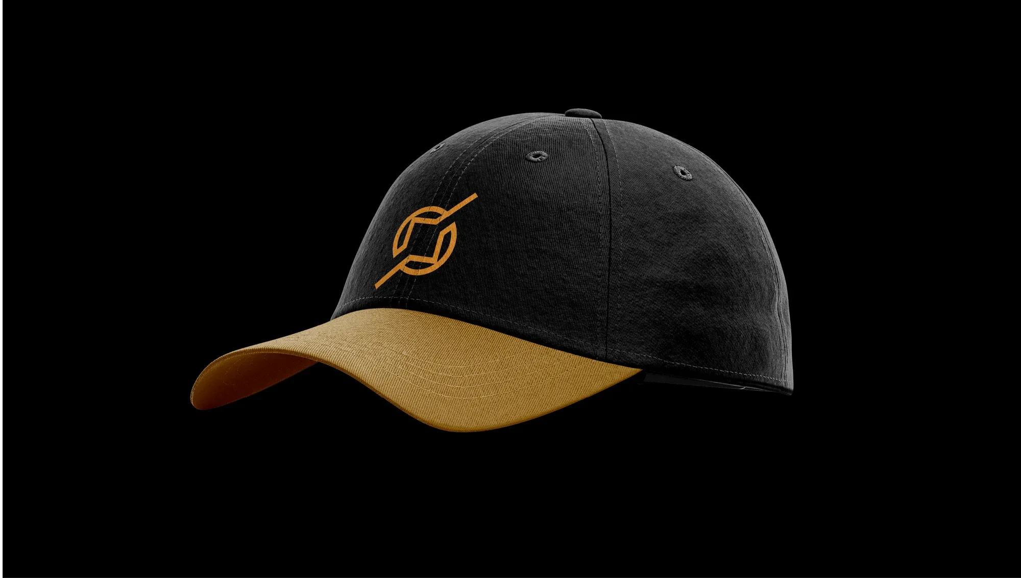 A black cap on black, its underbrim and embroidered mark picked out in gold.