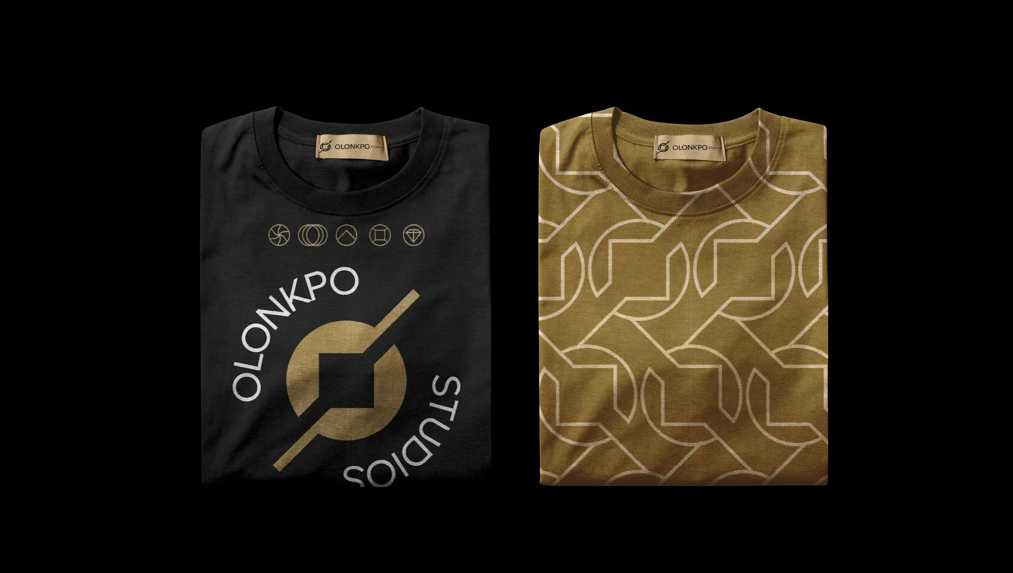 Two folded shirts — one black carrying the wordmark, one printed all over in the gold pattern.