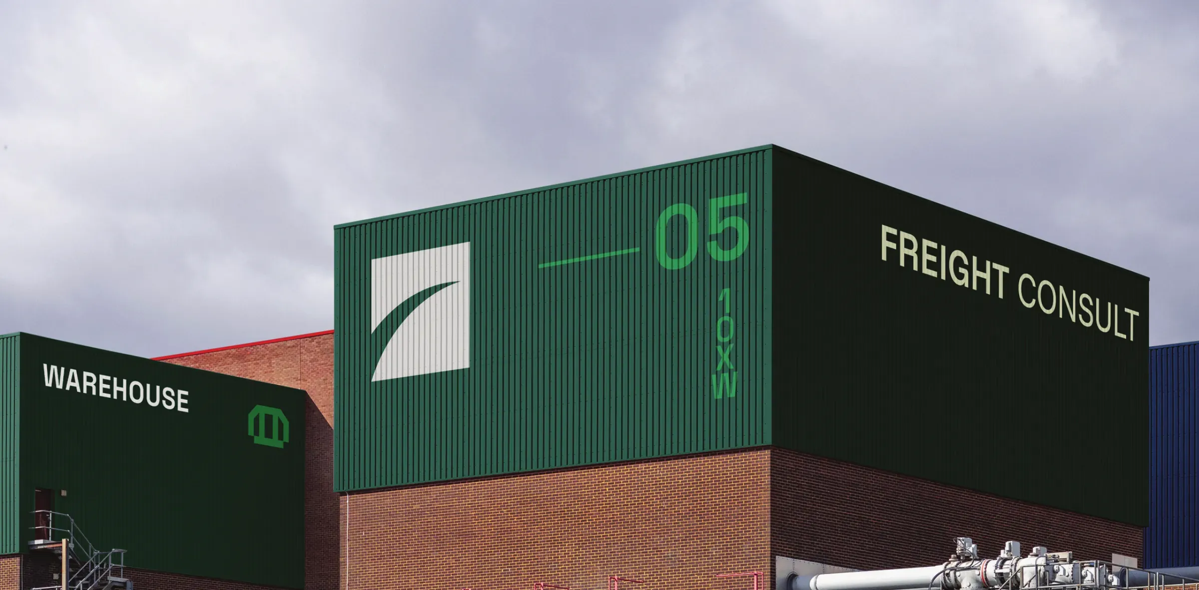 Freight Consult warehouse exterior with the refreshed mark applied at architectural scale.